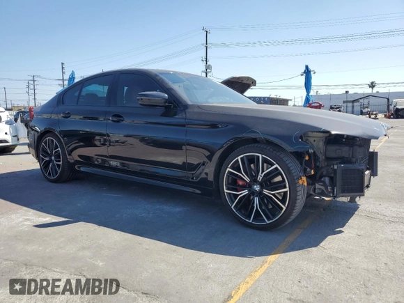 2021 BMW 5 Series 540i with VIN WBA53BJ05MWW92487, listed as a Copart auction lot 57679975 with 53,311 mi miles and Salvage title. Bid and sale history available at DreamBid. Image 4.