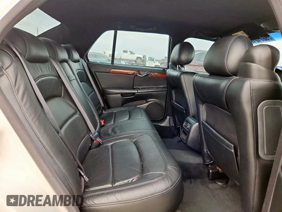 2004 Cadillac DeVille z VIN 1G6KD54Y04U111840, wystawiony jako Copart lot #56712195 z przebiegiem 60 378 mil mil oraz Szkody całkowita. Historia ofert i sprzedaży dostępna na DreamBid. Obrazek 10.