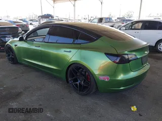 2020 Tesla Model 3 Standard Range Plus with VIN 5YJ3E1EA4LF799650, listed as a IAAI auction lot 41817538 with 54,835 mi miles. Bid and sale history available at carsss.com. Image 3.