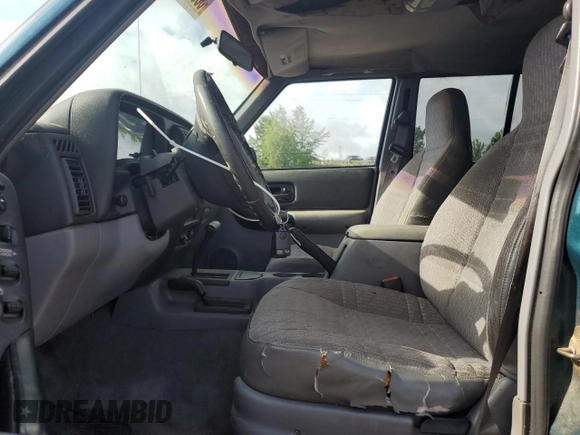 1998 Jeep Cherokee Sport with VIN 1J4FJ68S9WL249365, listed as a Copart auction lot 58896155 with 344,530 mi miles and Clean title. Bid and sale history available at DreamBid. Image 7.