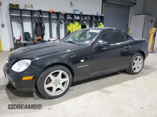 2000 Mercedes-Benz SLK-Class Kompressor with VIN WDBKK47F4YF165805, listed as a Copart auction lot 86942634 with 86,624 mi miles and Salvage Title. Bid and sale history available at carsss.com. Image 1.