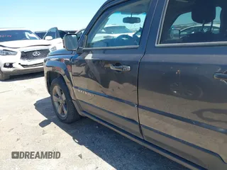 2014 Jeep Patriot Latitude with VIN 1C4NJPFA3ED928123, listed as a IAAI auction lot 41767231 with 136,318 mi miles and . Bid and sale history available at carsss.com. Image 6.