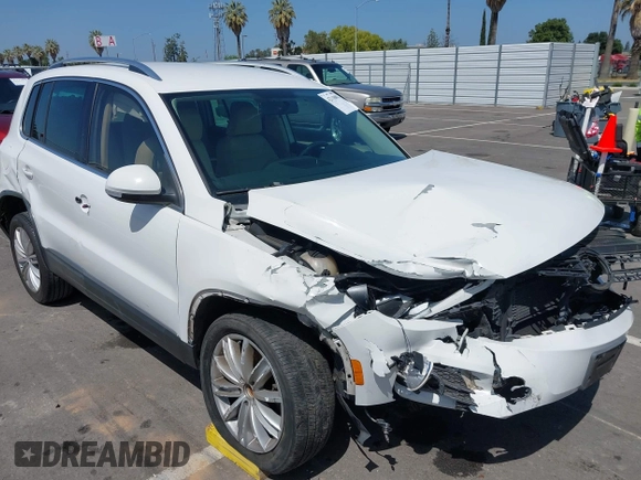 2014 Volkswagen Tiguan SEL with VIN WVGAV3AX9EW512956, listed as a IAAI auction lot 42110002 with 136,034 mi miles and . Bid and sale history available at DreamBid. Image 6.