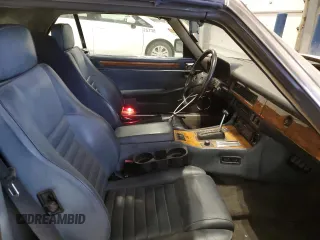 1989 Jaguar XJS z VIN SAJNV4847KC164497, wystawiony jako Copart lot #87258504 z przebiegiem 90 299 mil mil oraz Szkody całkowita. Historia ofert i sprzedaży dostępna na DreamBid. Obrazek 11.