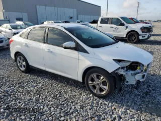 2014 Ford Focus SE with VIN 1FADP3F27EL412368, listed as a Copart auction lot 51463155 with 143,484 mi miles and Salvage Title. Bid and sale history available at DreamBid. Image 4.