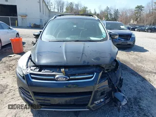 2014 Ford Escape Titanium with VIN 1FMCU9JX2EUA96338, listed as a IAAI auction lot 41806850 with 127,745 mi miles. Bid and sale history available at carsss.com. Image 6.