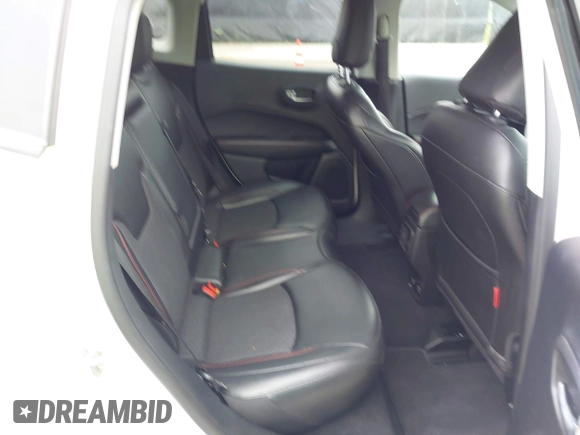 2020 Jeep Compass Trailhawk z VIN 3C4NJDDB8LT195584, wystawiony jako IAAI lot #42295678 z przebiegiem 99 762 mil mil oraz . Historia ofert i sprzedaży dostępna na DreamBid. Obrazek 8.