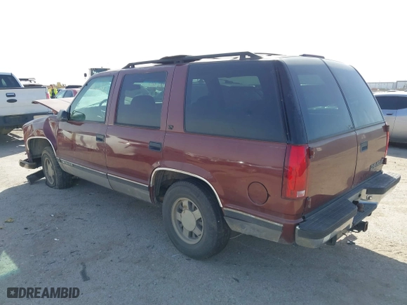 1999 Chevrolet Tahoe with VIN 1GNEC13R9XJ341261, listed as a IAAI auction lot 41741710 with 234,676 mi miles. Bid and sale history available at carsss.com. Image 3.