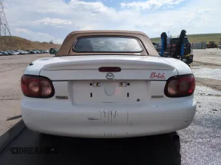 2002 Mazda MX-5 Miata Cloth z VIN JM1NB353X20229549, wystawiony jako Copart lot #54549205 z przebiegiem 79 871 mil mil oraz Szkoda całkowita • Salvage title. Historia ofert i sprzedaży dostępna na DreamBid. Obrazek 6.