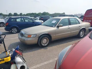 2000 Mercury Grand Marquis LS z VIN 2MEFM75W7YX729323, wystawiony jako IAAI lot #42475457 z przebiegiem 148 910 mil mil oraz . Historia ofert i sprzedaży dostępna na DreamBid. Obrazek 2.