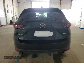 2018 Mazda CX-5 Grand Touring with VIN JM3KFBDM4J0412835, listed as a Copart auction lot 55441315 with 191,968 mi miles and Salvage title. Bid and sale history available at DreamBid. Image 6.