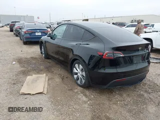 2023 Tesla Model Y Long Range z VIN 7SAYGDEEXPA181114, wystawiony jako IAAI lot #41564617 z przebiegiem 64 990 mil mil oraz . Historia ofert i sprzedaży dostępna na DreamBid. Obrazek 3.