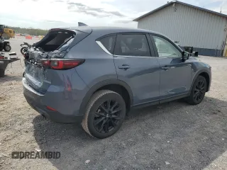 2023 Mazda CX-5 S Carbon Edition z VIN JM3KFBCM9P0158890, wystawiony jako Copart lot #53839045 z przebiegiem 26 623 mil mil oraz Szkody całkowita. Historia ofert i sprzedaży dostępna na DreamBid. Obrazek 3.