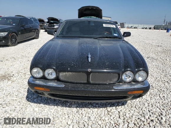 2002 Jaguar XJ with VIN SAJDA15BX2MF47193, listed as a Copart auction lot 49065275 with 69,544 mi miles and Salvage title. Bid and sale history available at DreamBid. Image 5.