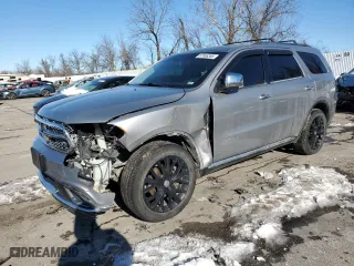 2015 Dodge Durango Citadel with VIN 1C4RDJEG7FC799354, listed as a Copart auction lot 87958385 with 217,849 mi miles and Salvage Title. Bid and sale history available at carsss.com. Image 1.