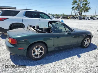 1999 Mazda MX-5 Miata with VIN JM1NB3530X0118452, listed as a Copart auction lot 53337575 with 150,574 mi miles and Clean title. Bid and sale history available at DreamBid. Image 3.