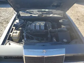 1990 Chrysler New Yorker z VIN 1C3XY66R4LD784183, wystawiony jako Copart lot #75364784 z przebiegiem 114 456 mil mil oraz Tytuł czysty. Historia ofert i sprzedaży dostępna na DreamBid. Obrazek 11.