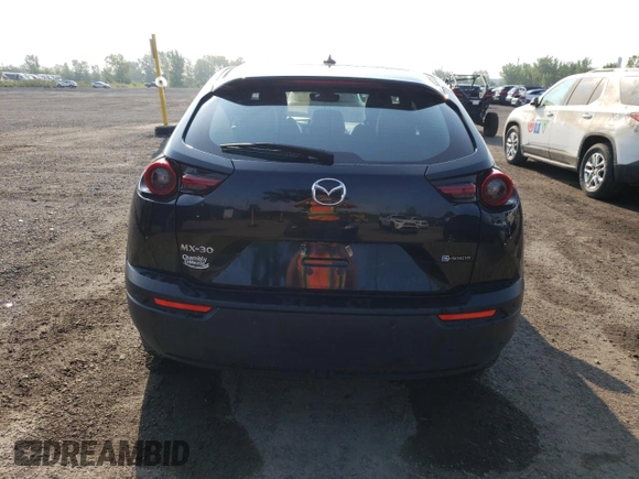 2022 Mazda MX-30 Premium Plus z VIN JM1DRADB6N0101074, wystawiony jako Copart lot #68379044 z przebiegiem 43 559 mil mil oraz Szkody całkowita. Historia ofert i sprzedaży dostępna na DreamBid. Obrazek 6.