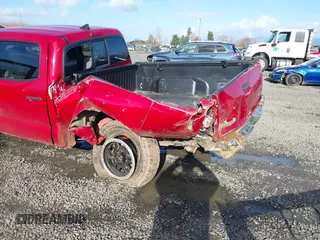 2015 Toyota Tacoma with VIN 3TMMU4FN1FM077045, listed as a IAAI auction lot 41670552 with 118,983 mi miles and . Bid and sale history available at DreamBid. Image 6.