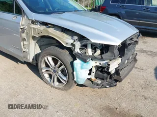 2016 Ford Fusion SE Hybrid z VIN 3FA6P0LU6GR121605, wystawiony jako IAAI lot #42651096 z przebiegiem 194 693 mil mil oraz . Historia ofert i sprzedaży dostępna na DreamBid. Obrazek 6.
