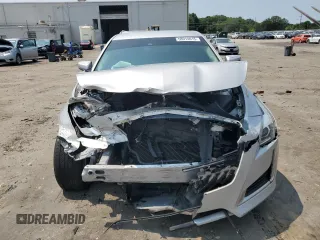 2014 Cadillac CTS Luxury AWD with VIN 1G6AX5SX5E0129143, listed as a Copart auction lot 58914015 with 131,465 mi miles and Salvage title. Bid and sale history available at DreamBid. Image 5.