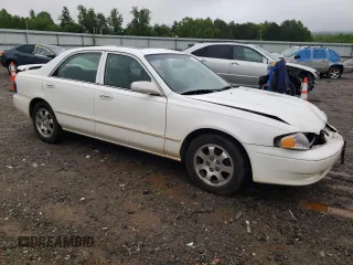 2001 Mazda 626 LX z VIN 1YVGF22C515251837, wystawiony jako Copart lot #56854605 z przebiegiem 173 148 mil mil oraz Szkody całkowita. Historia ofert i sprzedaży dostępna na DreamBid. Obrazek 4.