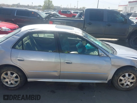 2002 Honda Accord EX z VIN JHMCG56612C026303, wystawiony jako IAAI lot #41992812 z przebiegiem 153 021 mil mil oraz . Historia ofert i sprzedaży dostępna na DreamBid. Obrazek 14.