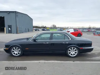 2004 Jaguar XJ with VIN SAJWA71C14SG20122, listed as a IAAI auction lot 41685767 with 113,392 mi miles. Bid and sale history available at carsss.com. Image 15.