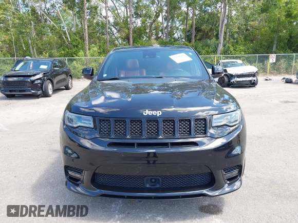 2017 Jeep Grand Cherokee SRT z VIN 1C4RJFDJ8HC653924, wystawiony jako IAAI lot #42108099 z przebiegiem 61 560 mil mil oraz . Historia ofert i sprzedaży dostępna na DreamBid. Obrazek 12.