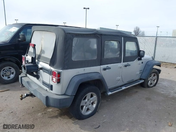 2010 Jeep Wrangler Unlimited Sport with VIN 1J4BA3H10AL112599, listed as a IAAI auction lot 41739263 with 156,301 mi miles. Bid and sale history available at carsss.com. Image 4.