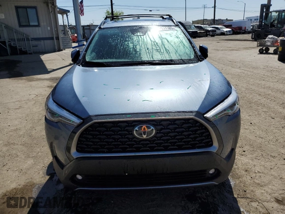 2023 Toyota Corolla Cross XLE with VIN 7MUDAAAG0PV063242, listed as a Copart auction lot 52511585 with 10,695 mi miles and Salvage title. Bid and sale history available at DreamBid. Image 5.
