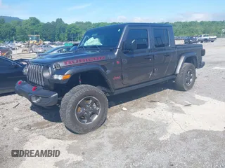 2021 Jeep Gladiator Rubicon z VIN 1C6JJTBG9ML592538, wystawiony jako IAAI lot #42206035 z przebiegiem 37 945 mil mil oraz . Historia ofert i sprzedaży dostępna na DreamBid. Obrazek 17.