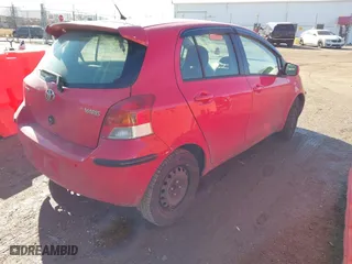 2009 Toyota Yaris with VIN JTDKT903495259976, listed as a IAAI auction lot 41670039 with 183,046 mi miles. Bid and sale history available at carsss.com. Image 4.