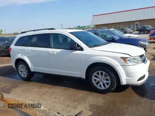 2014 Dodge Journey SE with VIN 3C4PDCAB0ET293641, listed as a IAAI auction lot 42001844 with 138,740 mi miles. Bid and sale history available at carsss.com. Image 13.