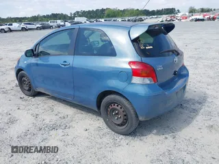 2009 Toyota Yaris with VIN JTDJT903X95227092, listed as a IAAI auction lot 42018166 with 120,605 mi miles. Bid and sale history available at carsss.com. Image 3.