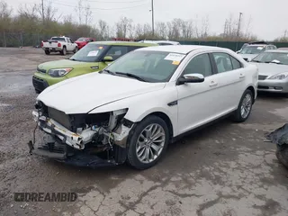 2015 Ford Taurus Limited with VIN 1FAHP2F85FG117635, listed as a IAAI auction lot 41979311 with 104,314 mi miles. Bid and sale history available at carsss.com. Image 2.