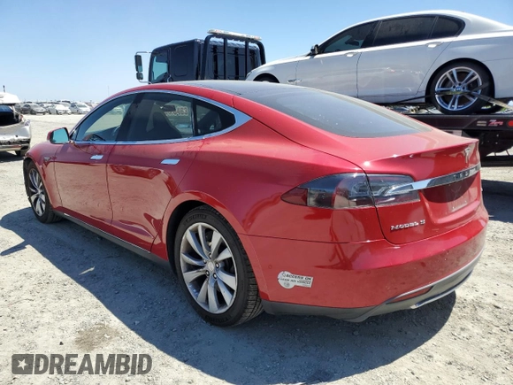 2014 Tesla Model S 60 with VIN 5YJSA1H17EFP64266, listed as a Copart auction lot 61678485 with 104,160 mi miles and Salvage title. Bid and sale history available at DreamBid. Image 2.