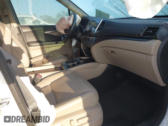 2017 Honda Pilot EX-L with VIN 5FNYF6H51HB037690, listed as a IAAI auction lot 41976359 with 126,055 mi miles and . Bid and sale history available at DreamBid. Image 5.