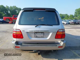 2001 Toyota Land Cruiser z VIN JTEHT05J912007249, wystawiony jako IAAI lot #42409963 z przebiegiem 303 292 mil mil oraz . Historia ofert i sprzedaży dostępna na DreamBid. Obrazek 16.