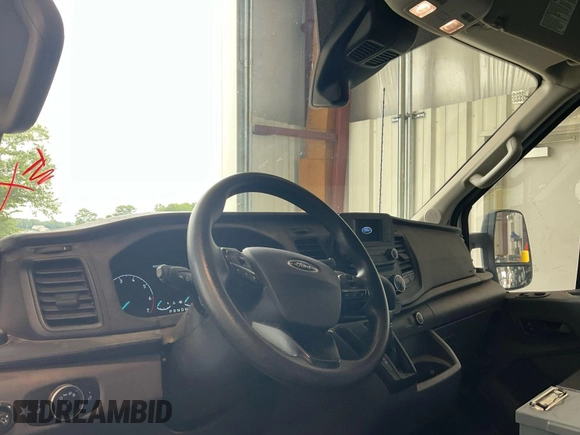 2021 Ford Transit Cargo with VIN 1FTBR1CG4MKA80751, listed as a IAAI auction lot 42859733 with 80,844 mi miles and . Bid and sale history available at DreamBid. Image 22.