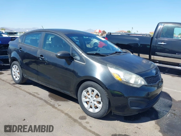 2014 Kia Rio LX with VIN KNADM4A39E6364490, listed as a IAAI auction lot 42128702 with 130,981 mi miles and . Bid and sale history available at DreamBid. Image 1.