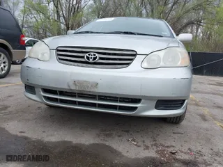 2003 Toyota Corolla CE with VIN JTDBR32E532012842, listed as a IAAI auction lot 41948108 with 299,999 mi miles. Bid and sale history available at carsss.com. Image 12.