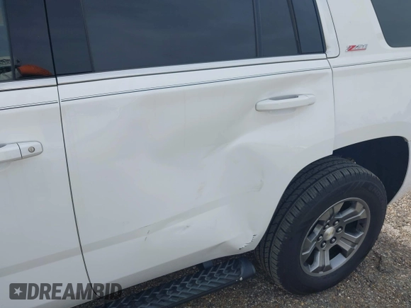 2017 Chevrolet Tahoe LT with VIN 1GNSKBKCXHR350028, listed as a IAAI auction lot 41684954 with 117,261 mi miles and . Bid and sale history available at DreamBid. Image 12.