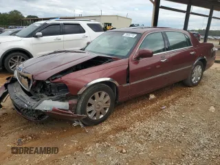 2003 Lincoln Town Car Cartier z VIN 1LNHM83W73Y638138, wystawiony jako Copart lot #73698774 z przebiegiem 205 583 mil mil oraz Szkoda całkowita • Salvage title. Historia ofert i sprzedaży dostępna na DreamBid. Obrazek 1.