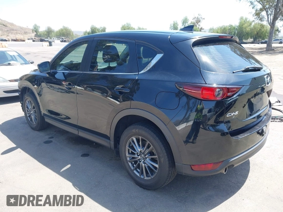 2019 Mazda CX-5 Sport with VIN JM3KFABM7K1509987, listed as a IAAI auction lot 42062804 with 50,898 mi miles and . Bid and sale history available at DreamBid. Image 3.