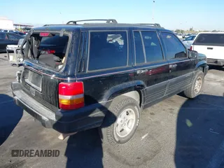 1998 Jeep Grand Cherokee Laredo with VIN 1J4FX58S8WC121904, listed as a IAAI auction lot 41145207 with 222,134 mi miles. Bid and sale history available at carsss.com. Image 4.