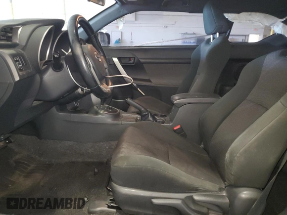 2013 Scion tC z VIN JTKJF5C75D3058143, wystawiony jako Copart lot #58116405 z przebiegiem 242 201 mil mil oraz Szkoda całkowita • Salvage title. Historia ofert i sprzedaży dostępna na DreamBid. Obrazek 7.
