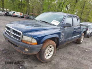 2004 Dodge Dakota Sport with VIN 1D7HL38K34S782067, listed as a IAAI auction lot 42012642 with 113,921 mi miles. Bid and sale history available at carsss.com. Image 2.