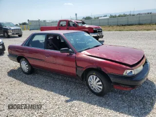 1991 Toyota Camry DLX z VIN 4T1SV21E4MU332100, wystawiony jako Copart lot #64645474 z przebiegiem 164 143 mil mil oraz Czysty tytuł • Clean title. Historia ofert i sprzedaży dostępna na DreamBid. Obrazek 4.