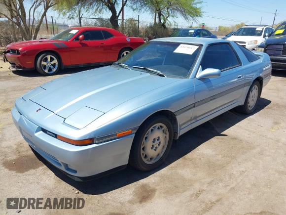 1989 Toyota Supra z VIN JT2MA71J7K0107654, wystawiony jako IAAI lot #42078617 z przebiegiem 181 176 mil mil oraz . Historia ofert i sprzedaży dostępna na DreamBid. Obrazek 2.
